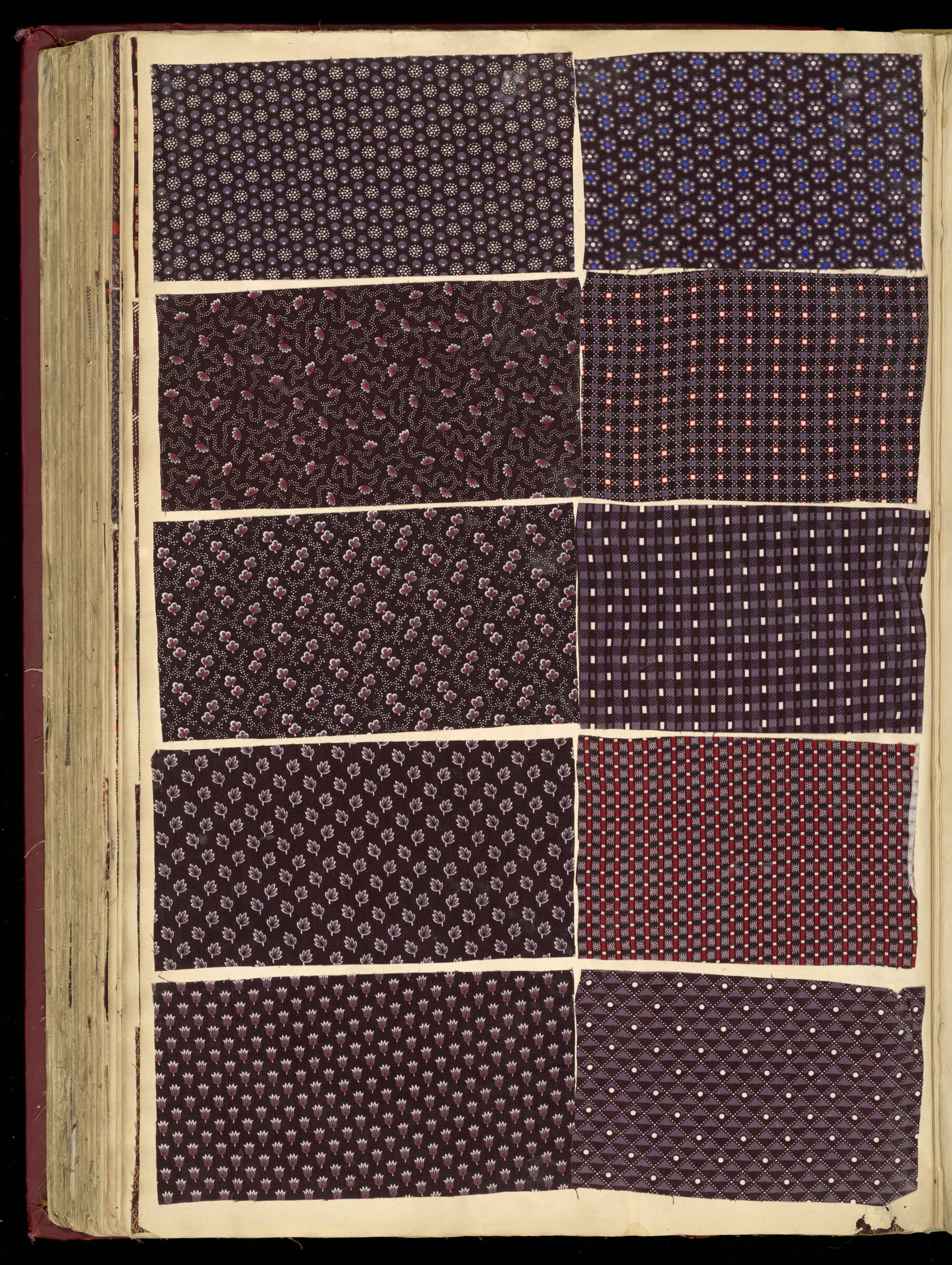 Page from a French fabric sample book of 1850 showing dark aubergine and burgundy printed cottons in a grid.